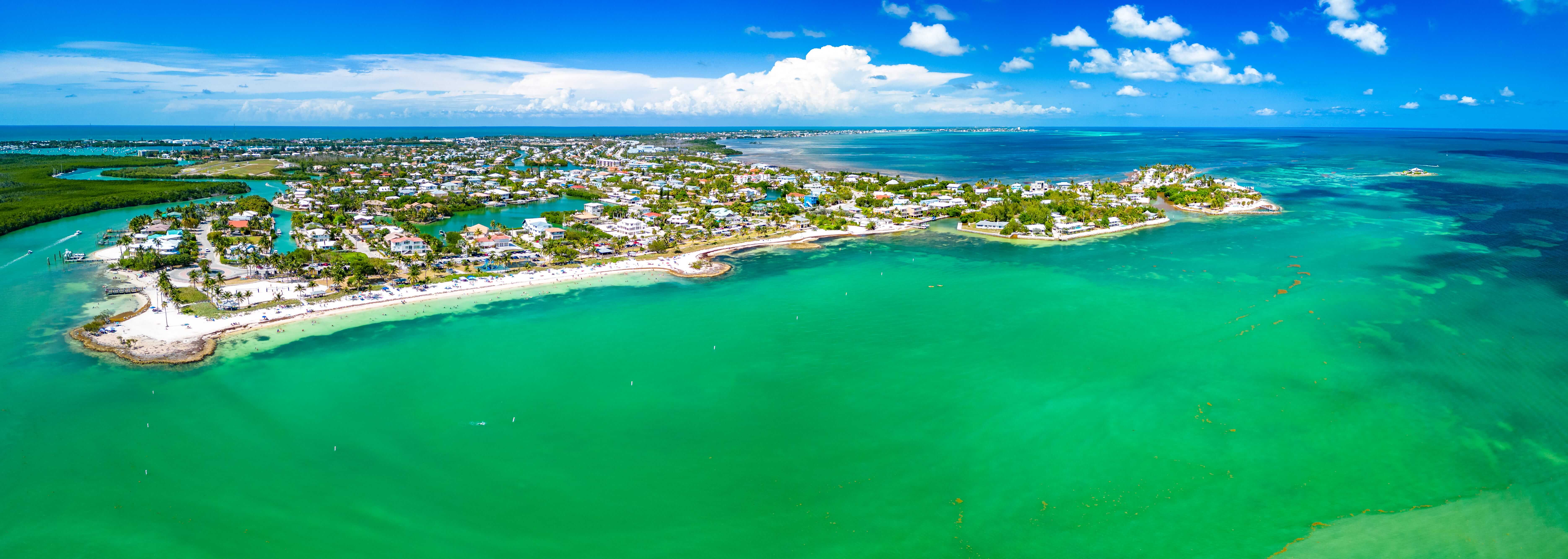 Palm-framed shoreline and turquoise water at Sombrero Beach in Marathon